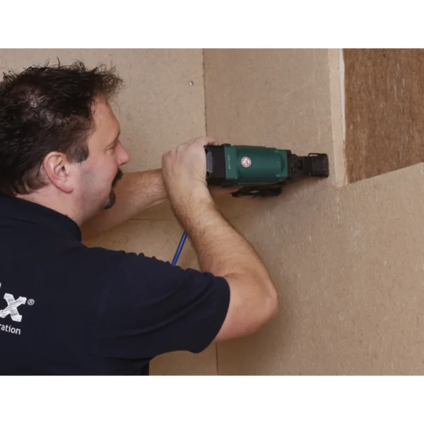 Compressed clay boards being installed using a stapler.​