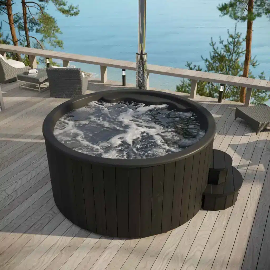 Black "Delux" hot tub with integrated heater, 2000mm diameter, ergonomic fiberglass seating for up to six people, and sleek thermowood exterior treated with weather-resistant stain for a luxurious outdoor spa experience.